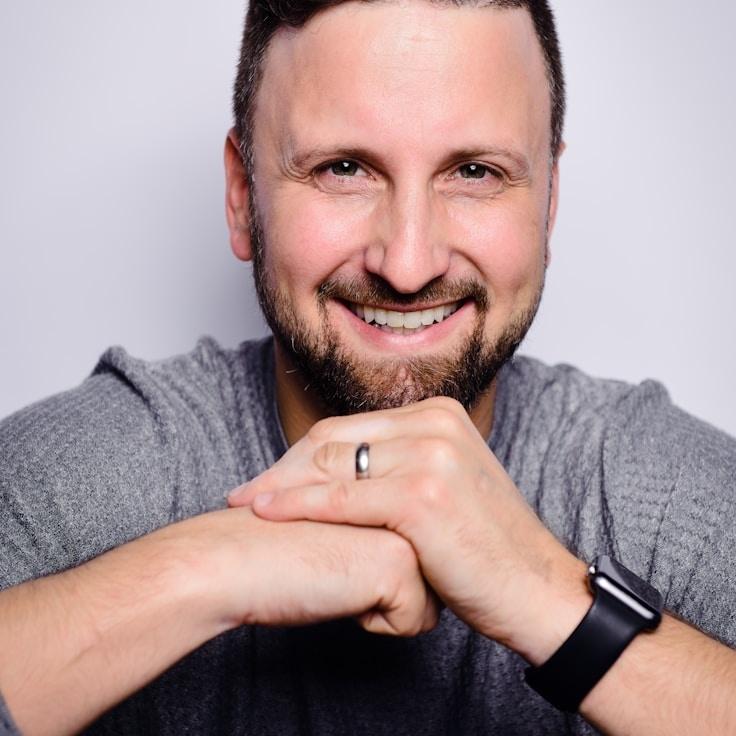 Ava Singh, Lead Design Curator at ParcelRouteBalanced, reviewing corporate floral arrangements